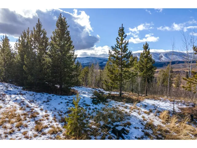 a view of a city with mountains in the background