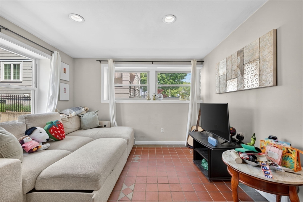 1800 Columbia Road, Unit 6 Boston, MA 02127 - Photo 5 of 11 a living room with furniture and a window
