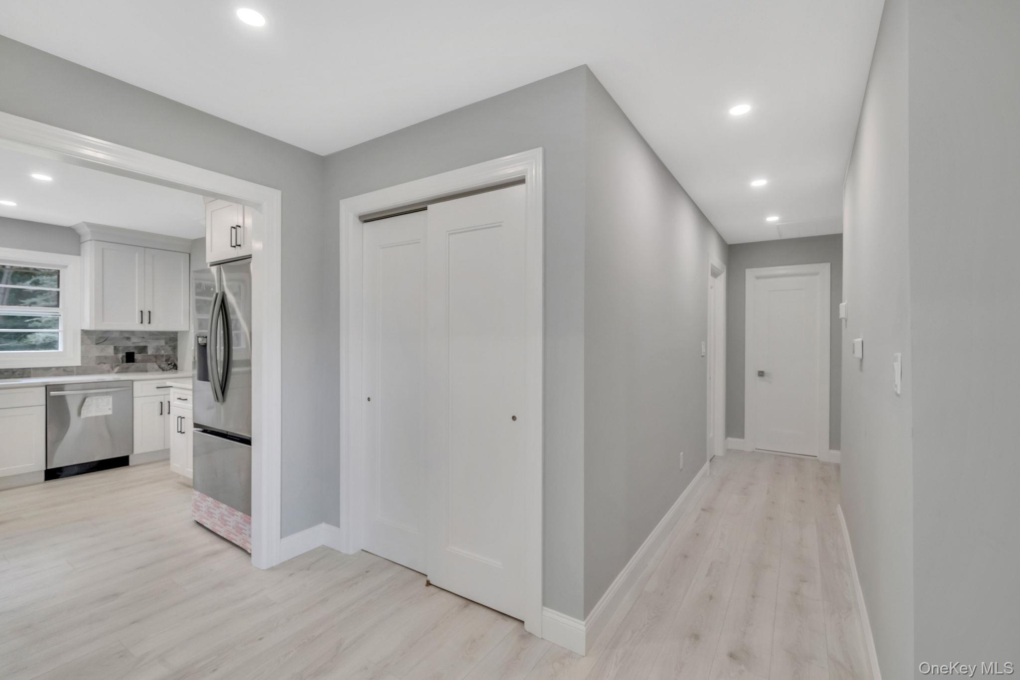 827 Aberdeen Road West Bay Shore, NY 11706 - Photo 17 of 40 Hallway featuring recessed lighting and light wood finished floors