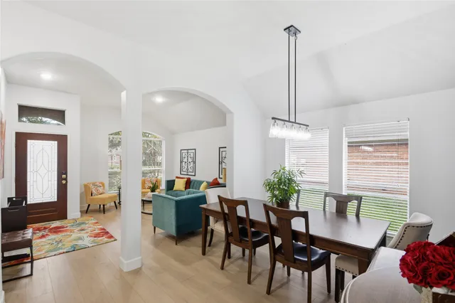 a view of a dining room with furniture and window