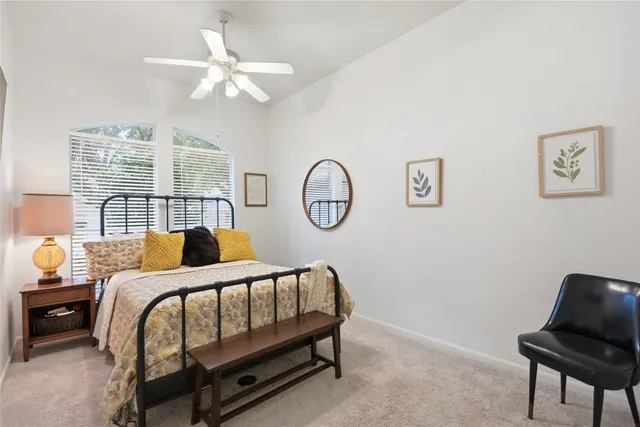 a bedroom with bed and a window