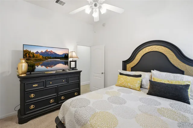 a bedroom with a bed and a dresser