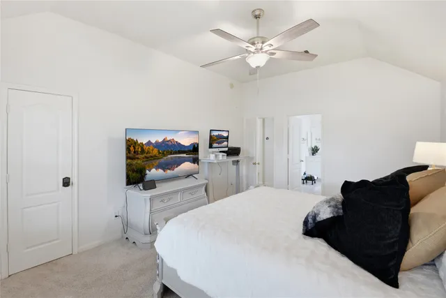 a spacious bathroom with a double vanity sink and a mirror