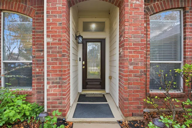a view of front door of house and stairs