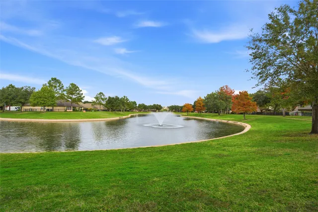 a view of a building with a yard