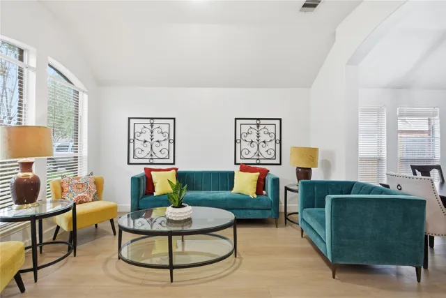 a living room with furniture and a window