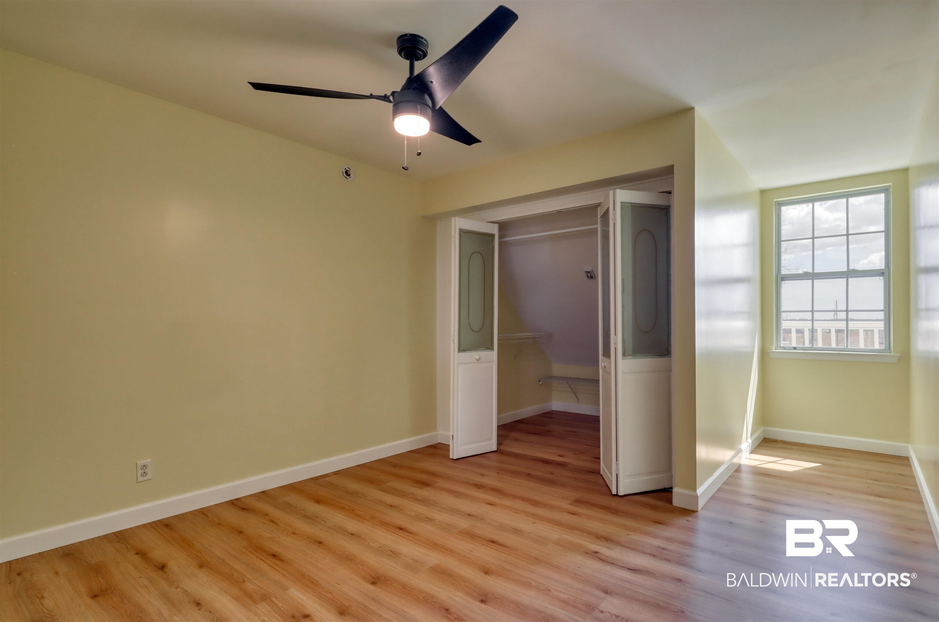 28461 Gardner Road Elberta, AL 36530 - Photo 18 of 46 Unfurnished bedroom with light wood-style flooring, a closet, and ceiling fan