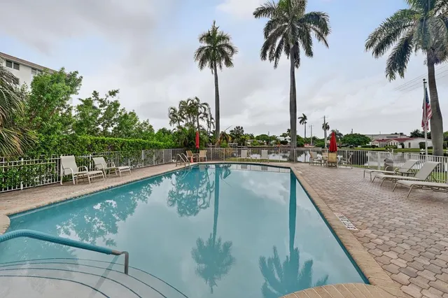 a view of a swimming pool with a lake view
