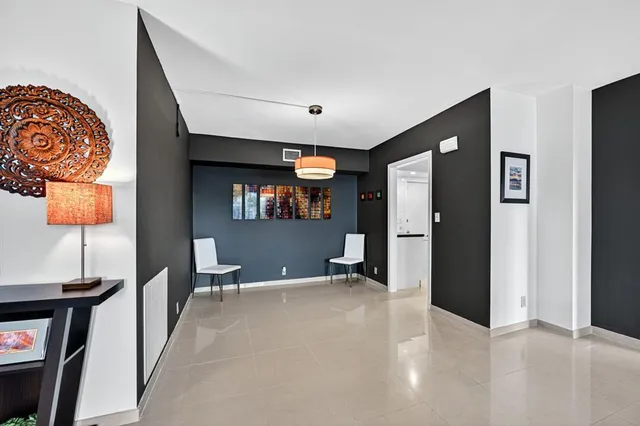 a view of a livingroom with furniture and window