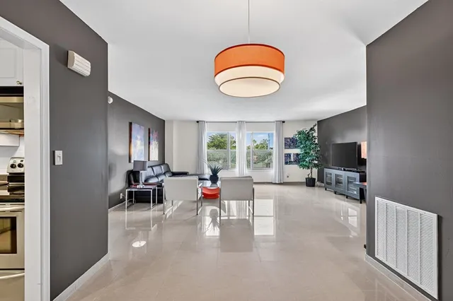 an outdoor living space with furniture and a window