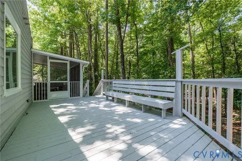 a view of backyard with deck and outdoor space
