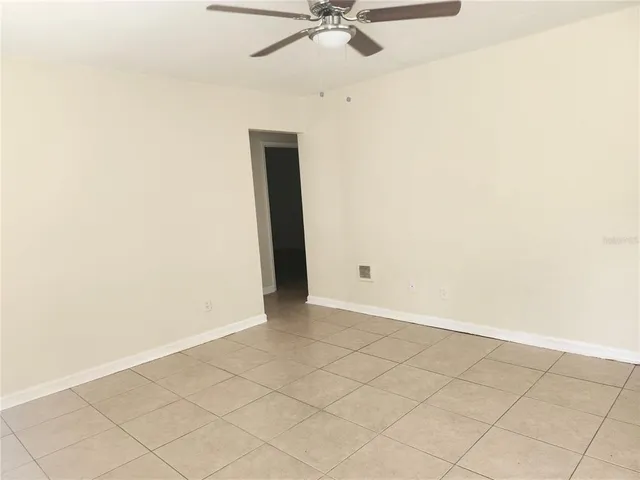 an empty room with fan