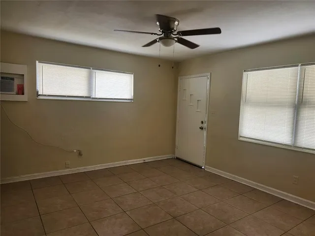 a view of an empty room with a window