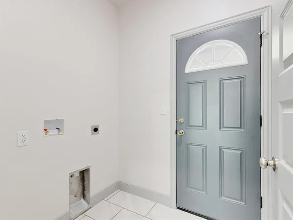 a view of a livingroom with wooden floor and a window
