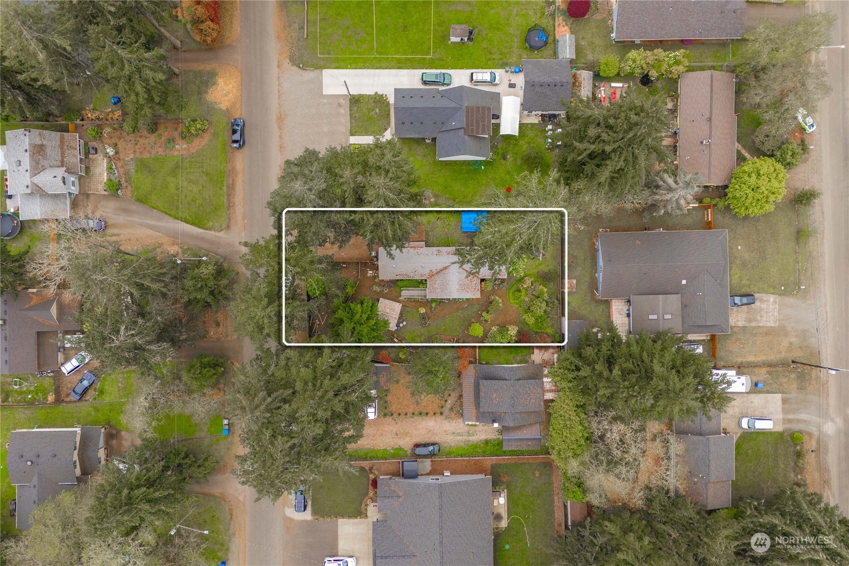 an aerial view of a houses with a yard