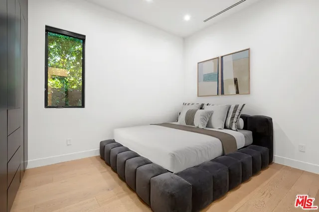 a bathroom with a sink mirror and toilet