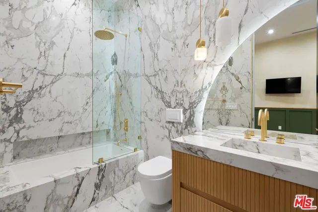 a utility room with sink dryer and washer