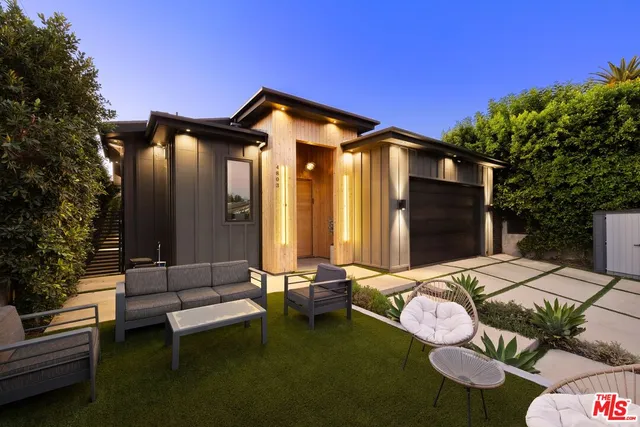 a large kitchen with a table and chairs