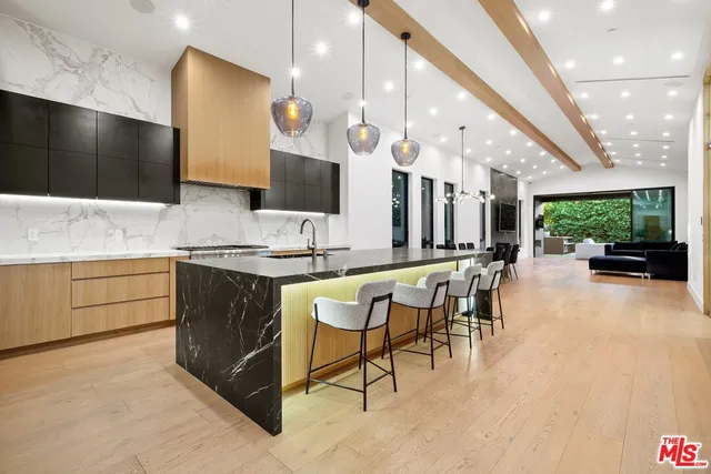 a kitchen with a table and chairs