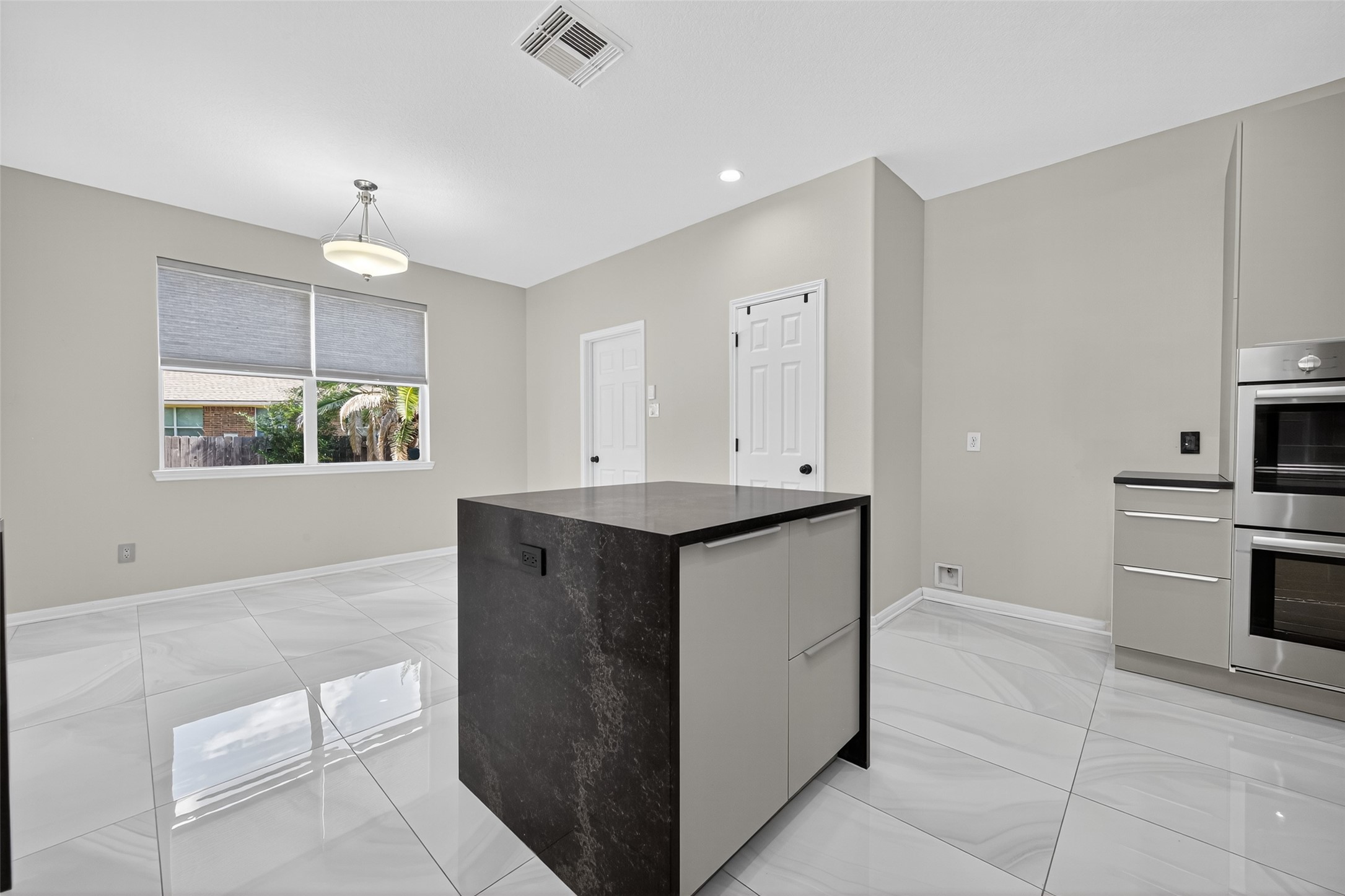 1003 Alp Springs Lane Spring, TX 77373 - Photo 13 of 43 a kitchen with cabinets and window