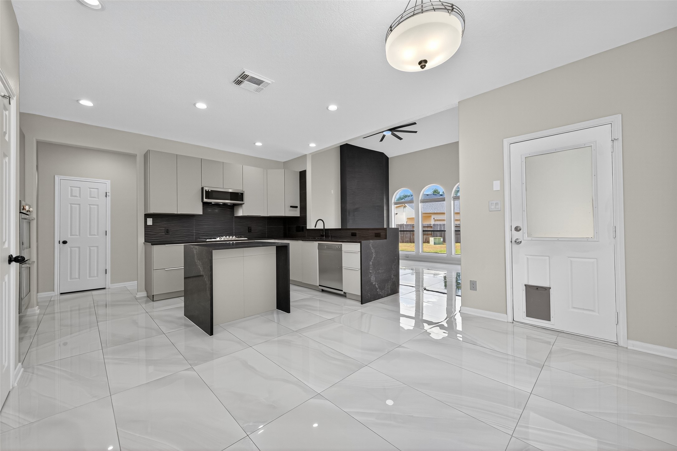 1003 Alp Springs Lane Spring, TX 77373 - Photo 15 of 43 a kitchen with stainless steel appliances granite countertop a refrigerator and a sink