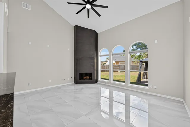 a view of an empty room with a window