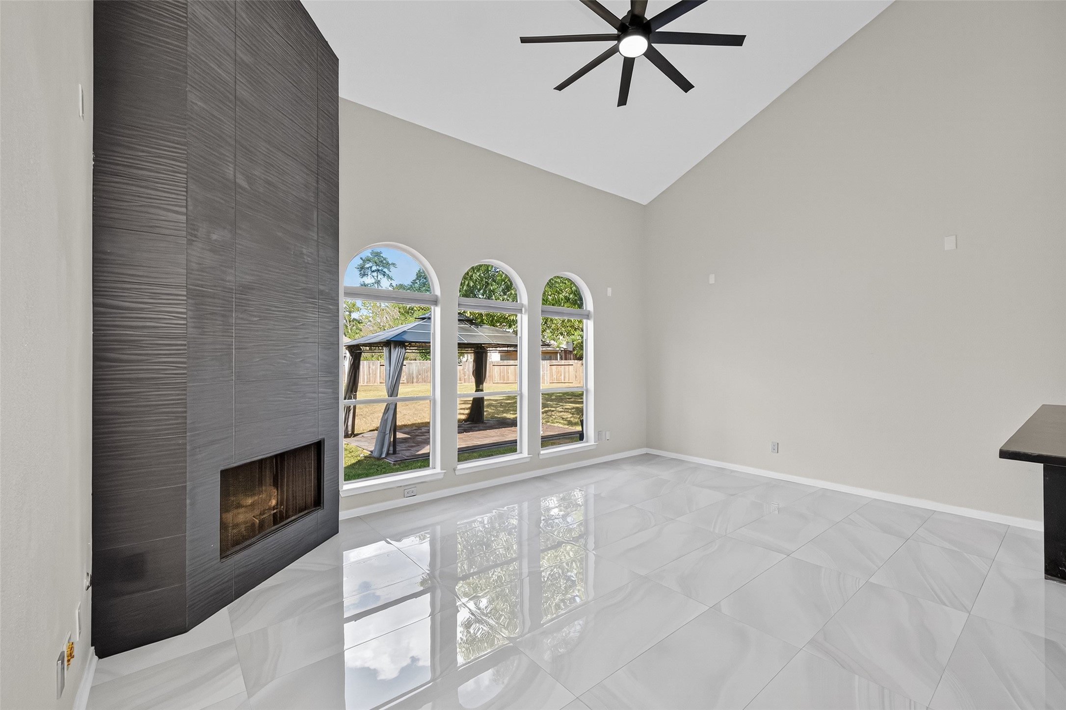 1003 Alp Springs Lane Spring, TX 77373 - Photo 19 of 43 an empty room with windows and fireplace