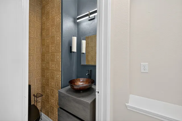 a bathroom with a sink and a mirror