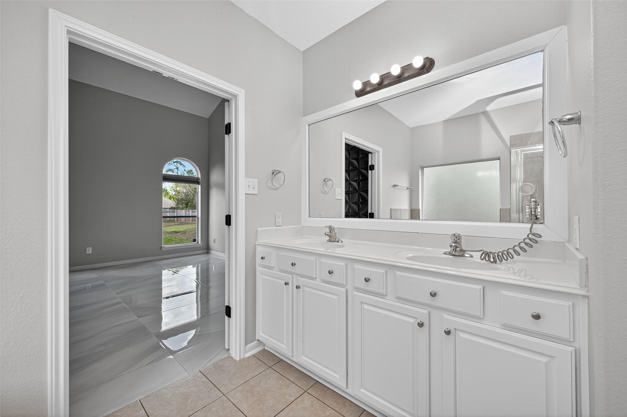 1003 Alp Springs Lane Spring, TX 77373 - Photo 26 of 43 a spacious bathroom with a granite countertop sink mirror and a