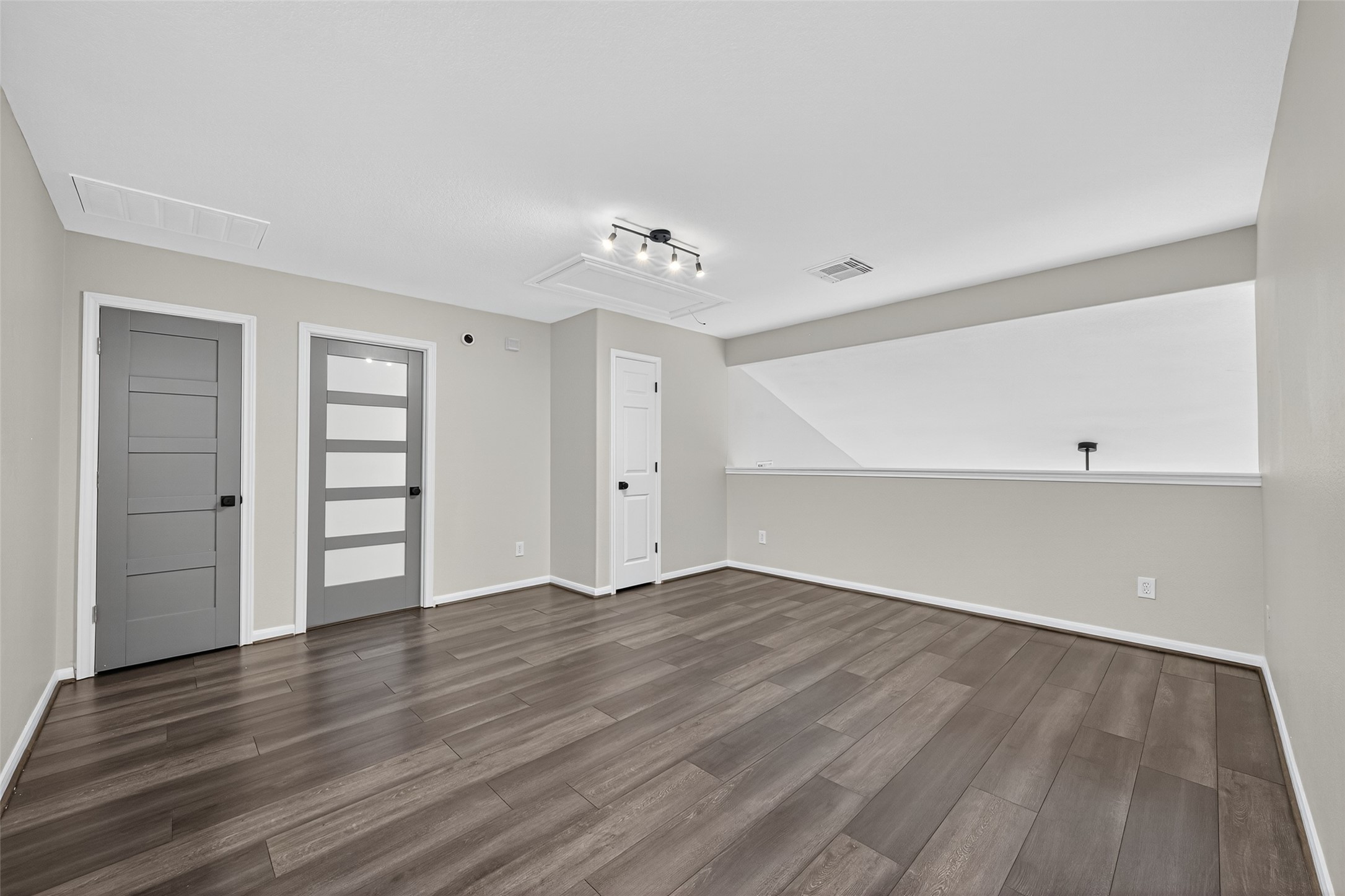 1003 Alp Springs Lane Spring, TX 77373 - Photo 31 of 43 an empty room with wooden floor closet and windows