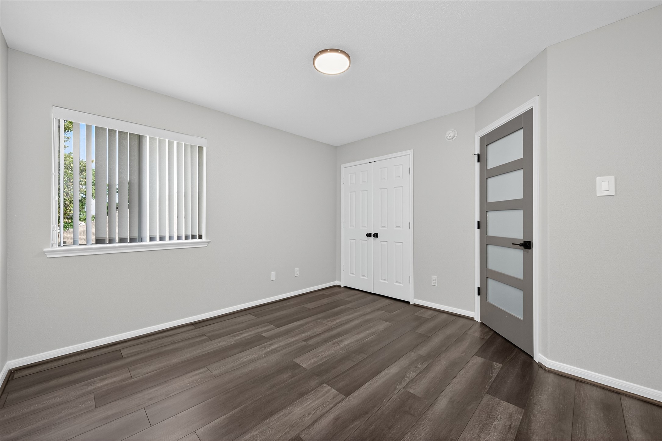 1003 Alp Springs Lane Spring, TX 77373 - Photo 36 of 43 wooden floor in an empty room with a window