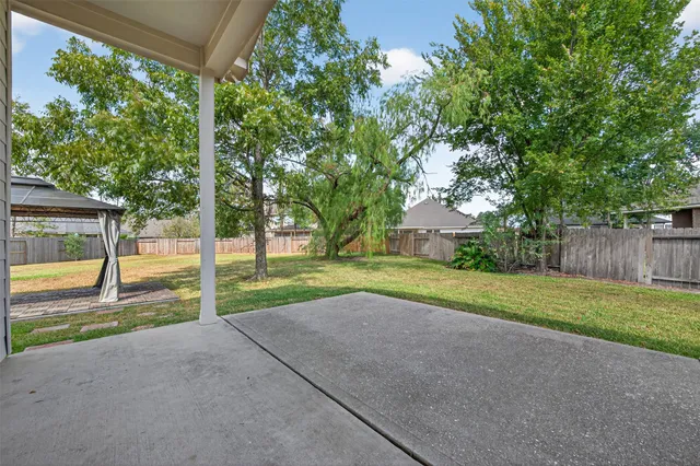 a view of backyard with green space