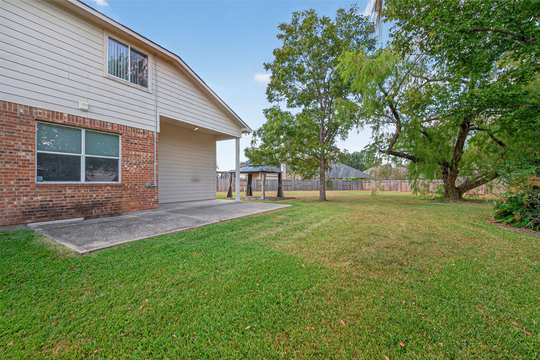 1003 Alp Springs Lane Spring, TX 77373 - Photo 38 of 43 a view of a house with backyard and a tree