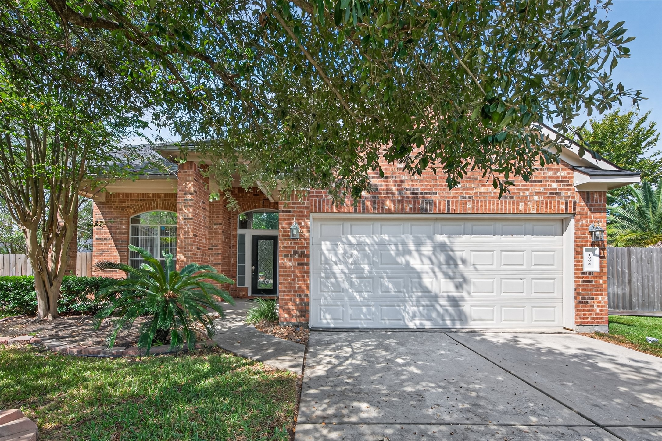 1003 Alp Springs Lane Spring, TX 77373 - Photo 4 of 43 a view of a house with a tree in the background