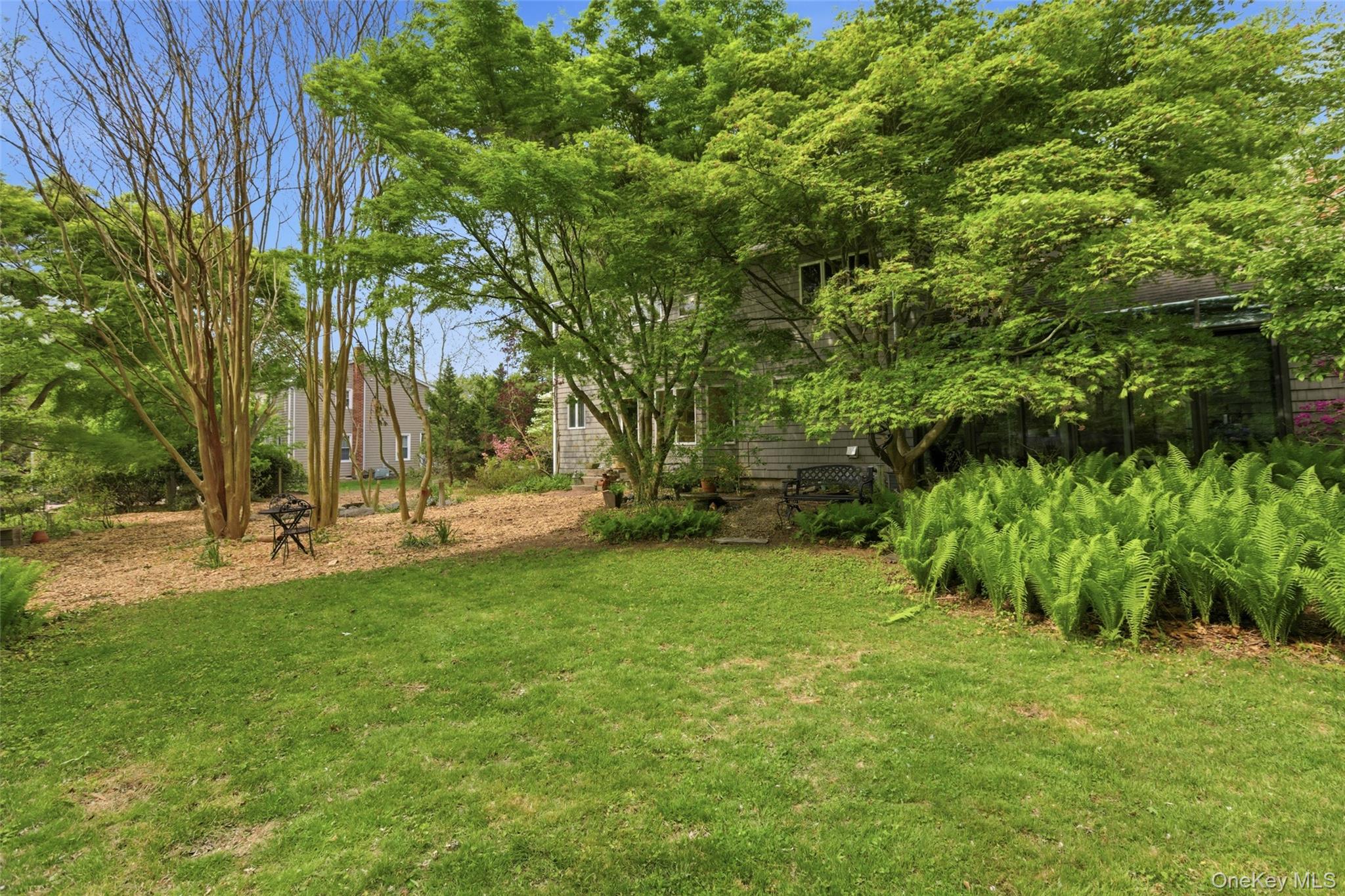 7 Gun Path Setauket, NY 11733 - Photo 4 of 34 a view of backyard with green space