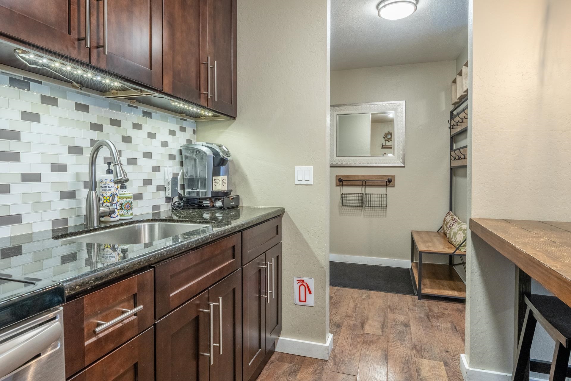 2289 Sierra Nevada Road, Unit F4 Mammoth Lakes, CA 93546 - Photo 15 of 22 a kitchen with granite countertop cabinets and sink