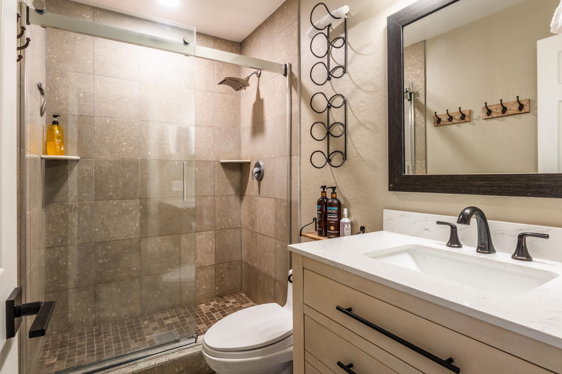 2289 Sierra Nevada Road, Unit F4 Mammoth Lakes, CA 93546 - Photo 5 of 22 a bathroom with a sink a toilet and shower