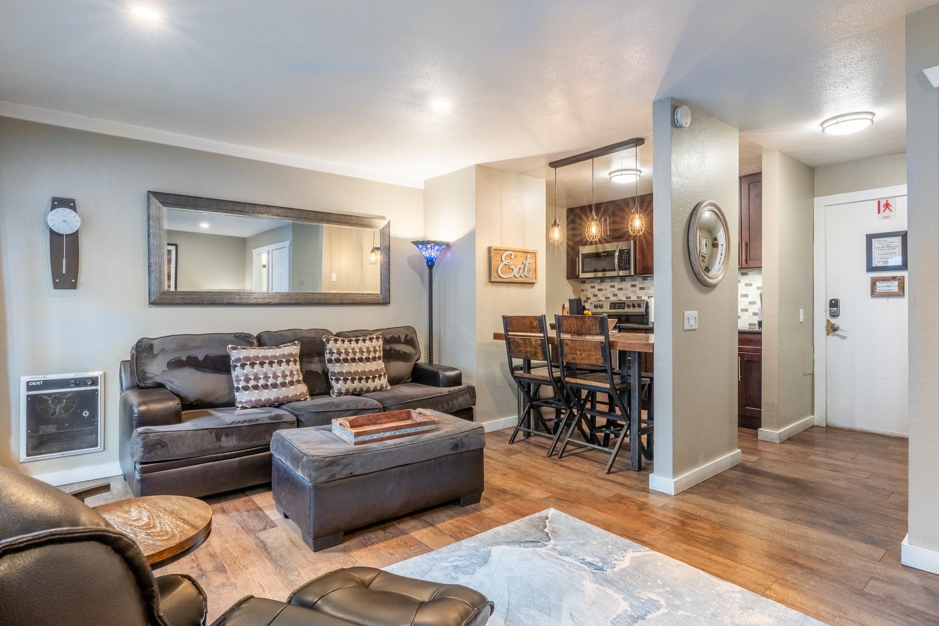 2289 Sierra Nevada Road, Unit F4 Mammoth Lakes, CA 93546 - Photo 7 of 22 a living room with furniture and a wooden floor