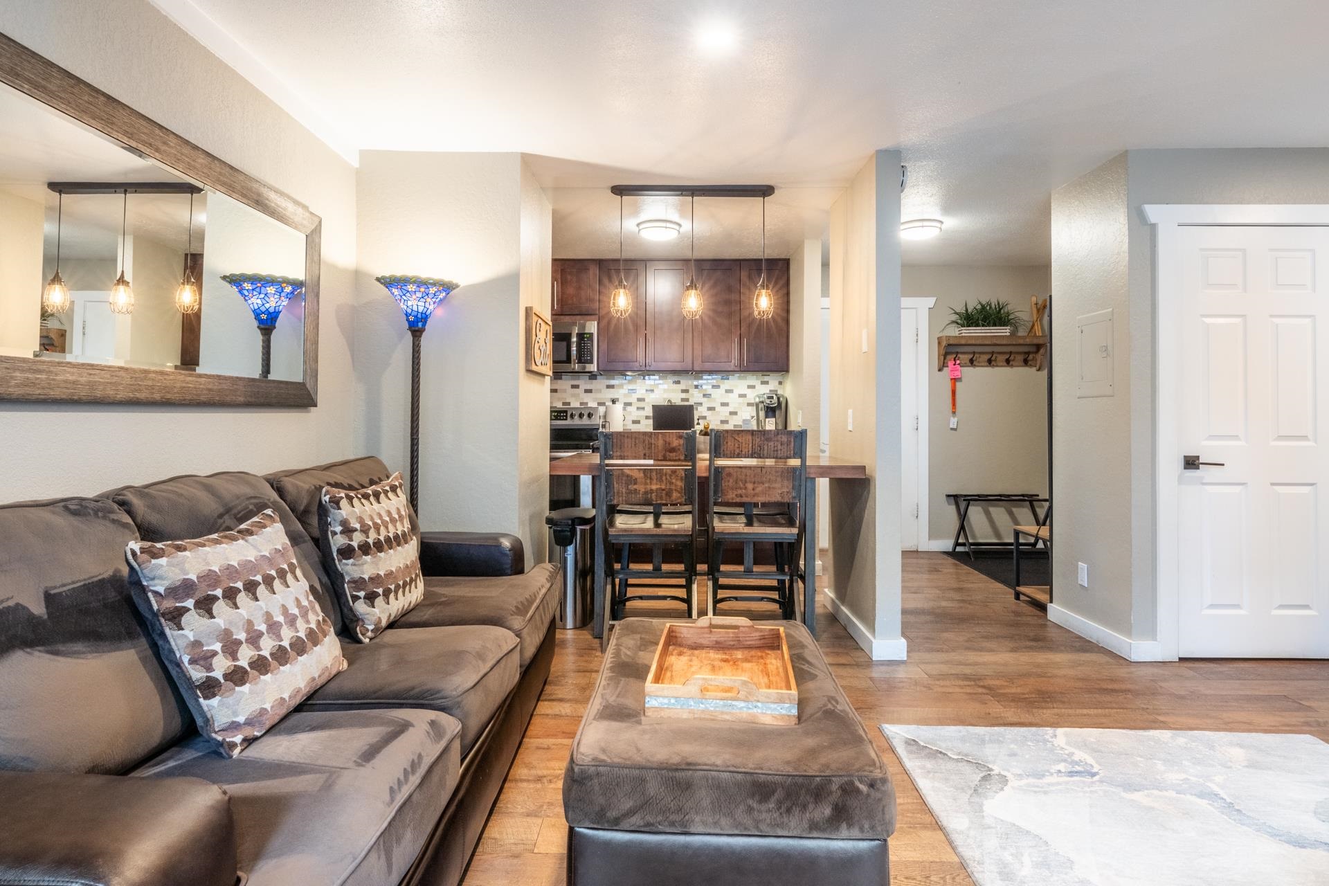 2289 Sierra Nevada Road, Unit F4 Mammoth Lakes, CA 93546 - Photo 9 of 22 a living room with furniture and a wooden floor
