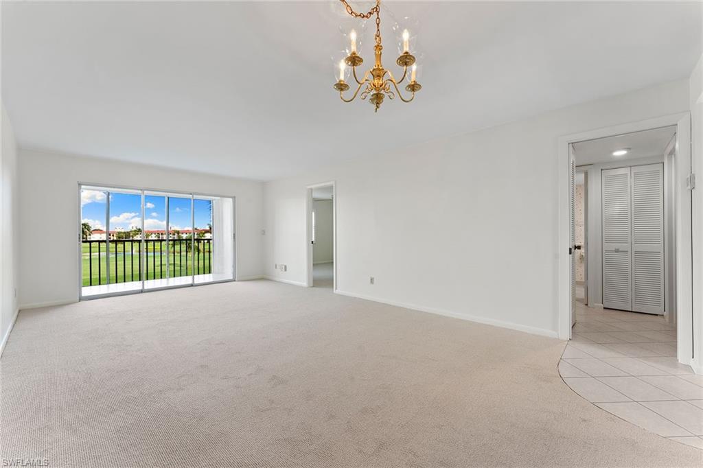 37 High Point Circle East, Unit 307 Naples, FL 34103 - Photo 11 of 20 a view of an empty room with a window