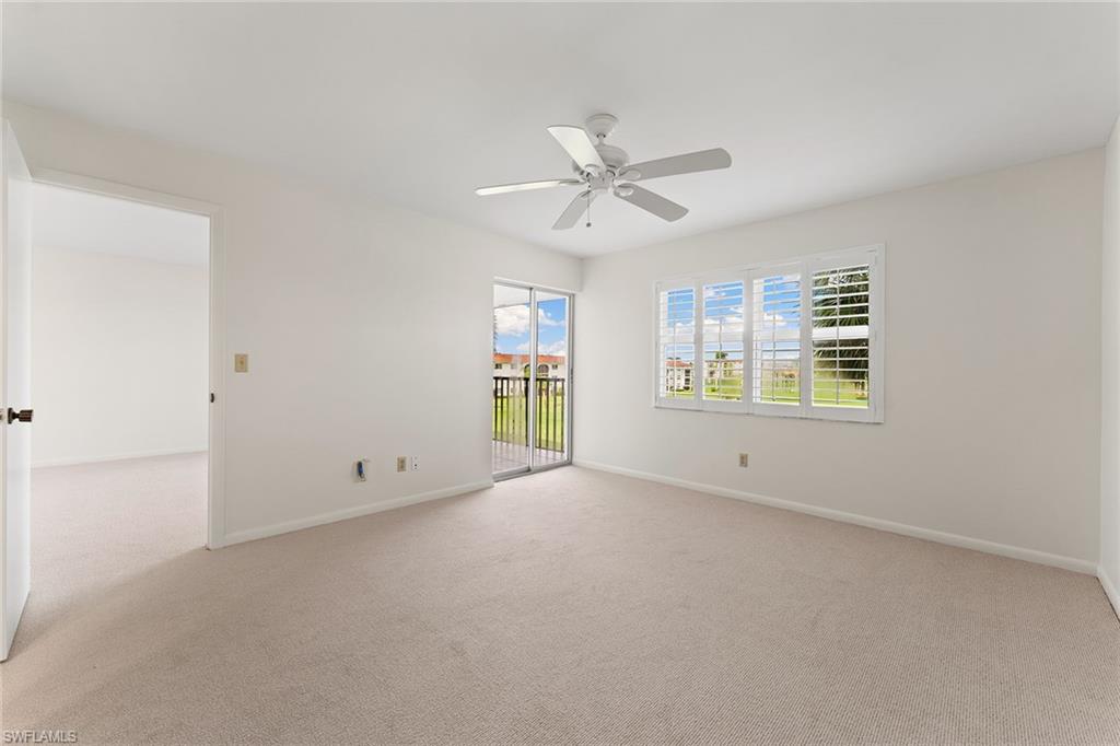 37 High Point Circle East, Unit 307 Naples, FL 34103 - Photo 13 of 20 a view of an empty room with a window