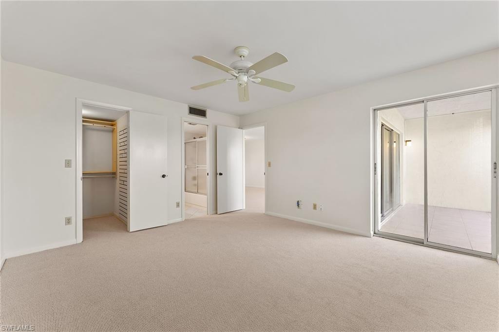 37 High Point Circle East, Unit 307 Naples, FL 34103 - Photo 15 of 20 an empty room with closet and a ceiling fan