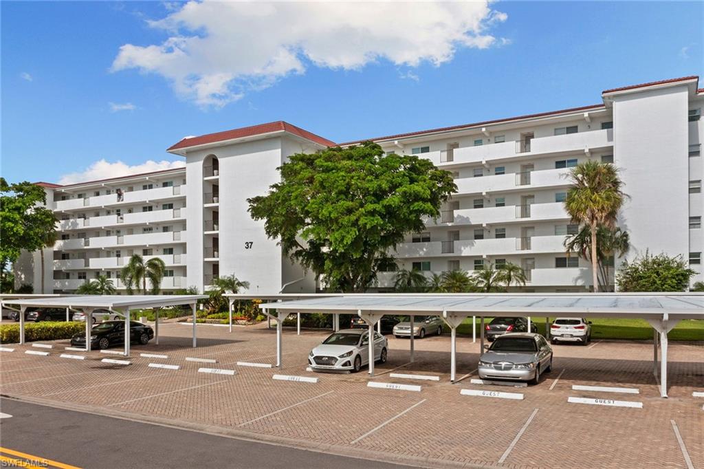 37 High Point Circle East, Unit 307 Naples, FL 34103 - Photo 3 of 20 a view of a building with sitting area