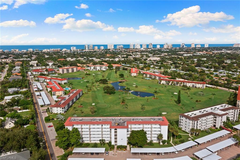 37 High Point Circle East, Unit 307 Naples, FL 34103 - Photo 4 of 20 an aerial view of a city