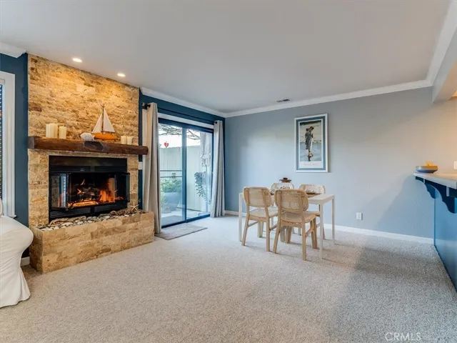 a kitchen with a table chairs and a dining table