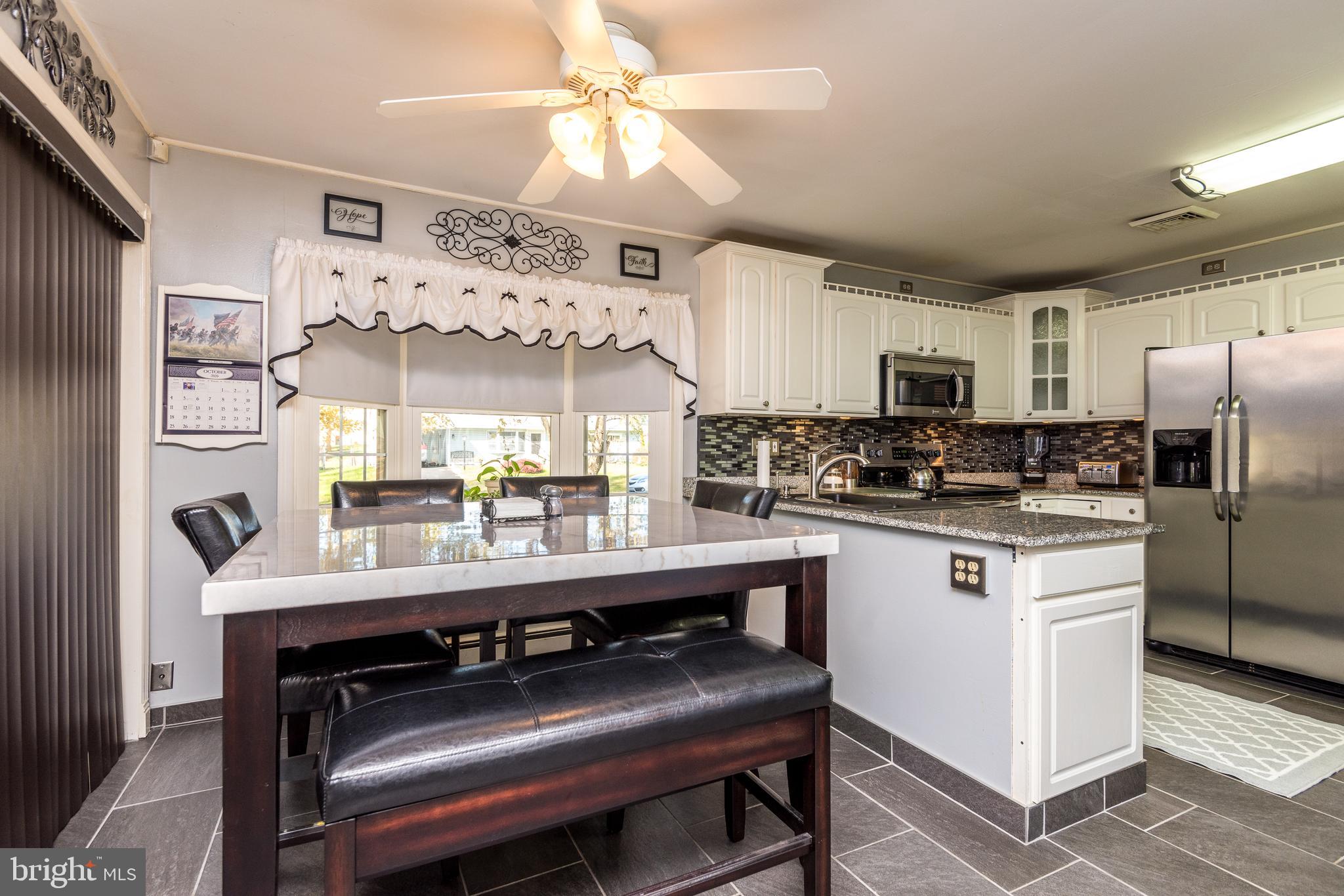 116 Border Rock Road Levittown, PA 19057 - Photo 7 of 27 Kitchen dining area holds a large table easily!