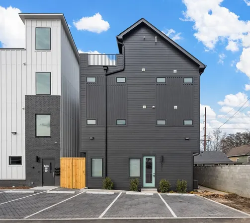 a view of a brick house with a yard