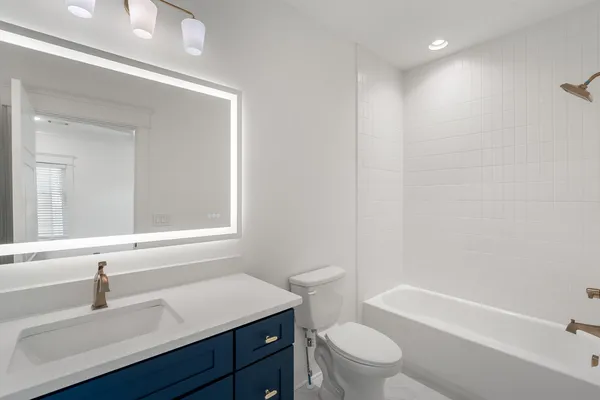 a bathroom with a sink a toilet and a bathtub