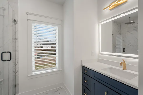 a bathroom with a sink a vanity and a mirror