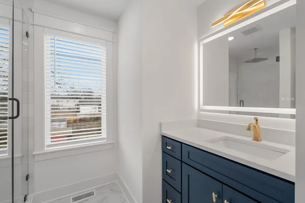 a bathroom with a sink and a mirror